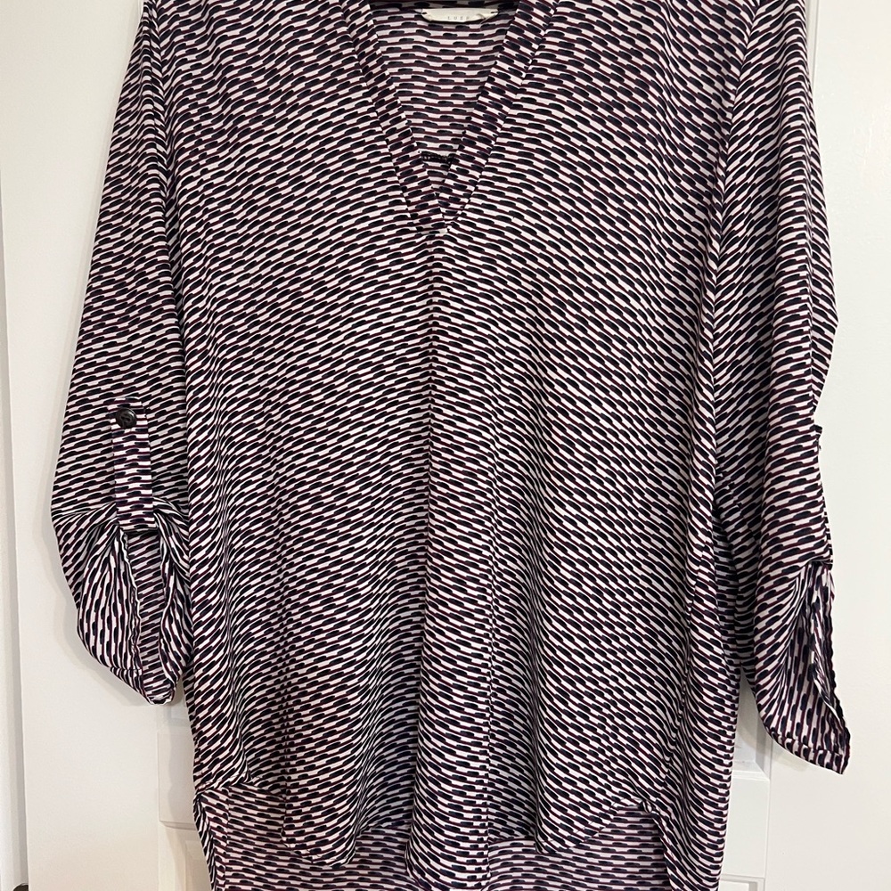 Black white blue and purple patterned blouse